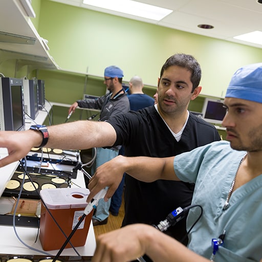 A resident in the general surgery residency works with a faculty member at Mayo Clinic in Rochester, Minnesota.