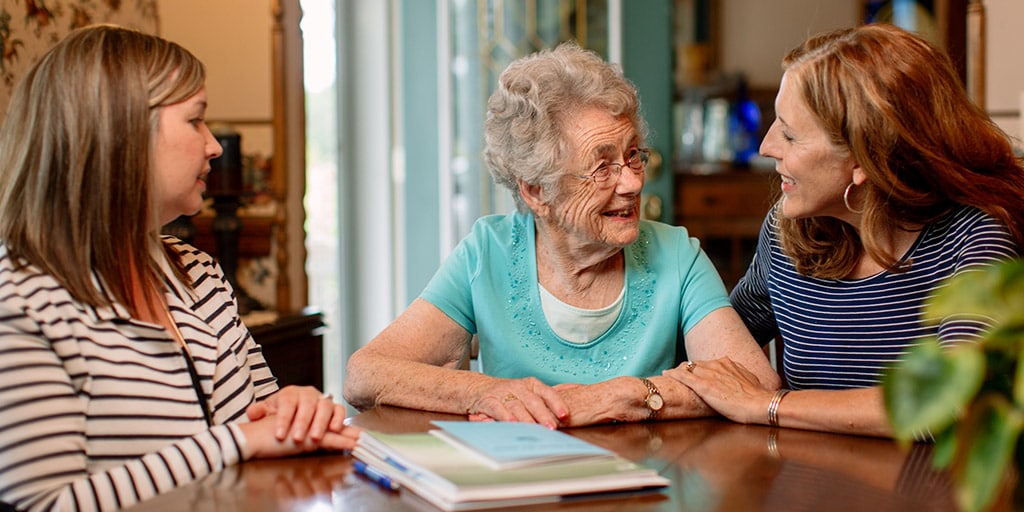 Mayo Clinic Geriatric Medicine fellow working with a patient and a family member in their home in Rochester, Minnesota.