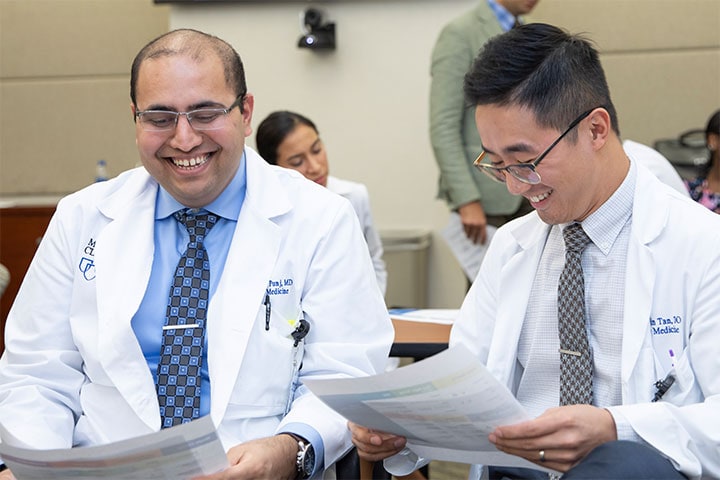 Two trainees laugh together at Mayo Clinic in Jacksonville, Florida.