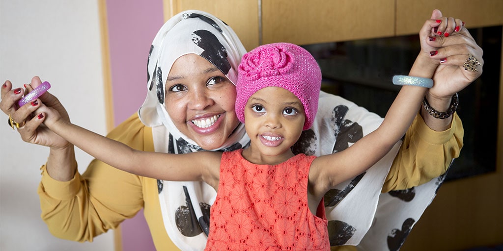 A pediatric oncology patient and caregiver at Mayo Clinic.