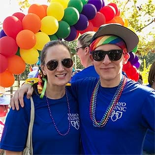Christina Zorn, chief administrative officer and LGBTI MERG executive sponsor at Mayo Clinic's campus in Jacksonville, Florida, attends Jacksonville's River City Pride Parade with Andrew Austin, chair of the LGBTI MERG.