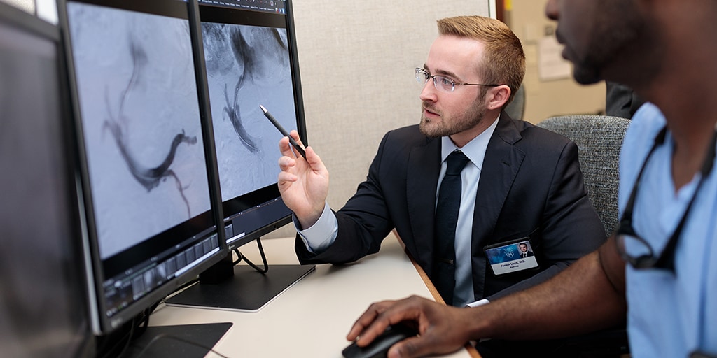 Interventional radiology residents looking at scans together at Mayo Clinic in Rochester, Minnesota.