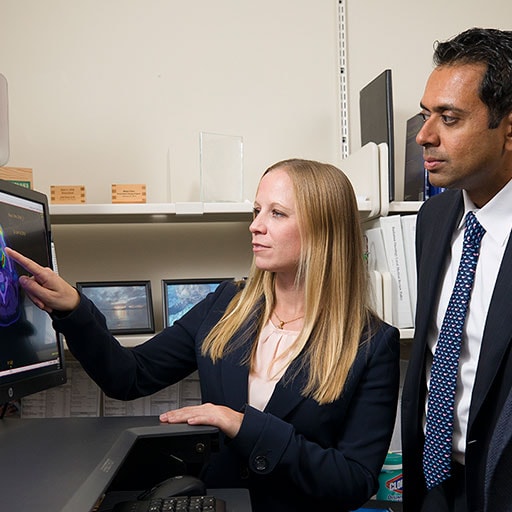 Radiation oncologists examine an image