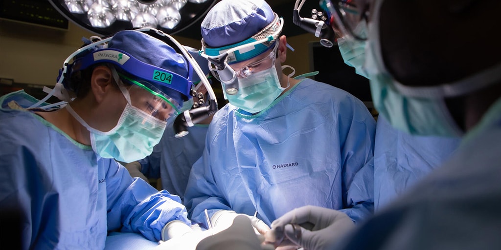 ENT residents work with faculty physicians in the operating room