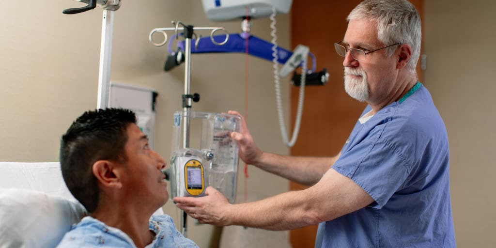 Pain medicine fellow examines a patient at Mayo Clinic in Arizona