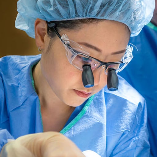 Plastic Surgery Resident works in the operating room at Mayo Clinic in Rochester, Minnesota.