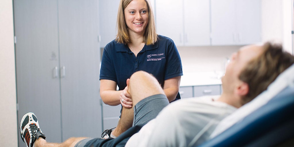 PM&R Sports Medicine fellow works with a patient at Mayo Clinic in Rochester, Minnesota.