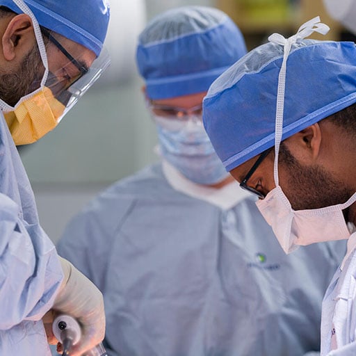 Neurosurgery physician and resident performing surgery in a Mayo Clinic Operating Room