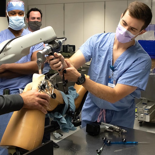 Orthopedic Surgery resident practices total knee arthroplasty bone cuts at the Center for Procedural Skills Mastery