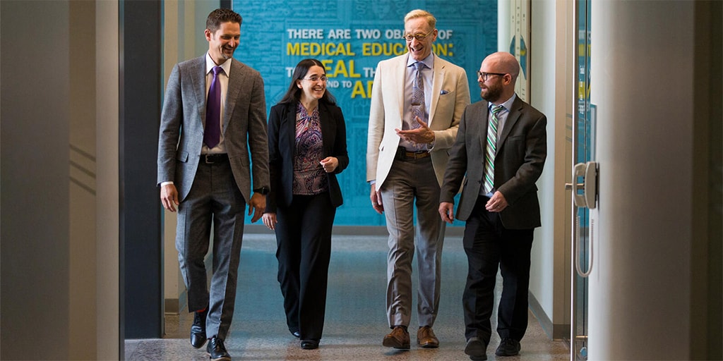 Pulmonary Pathology Fellowship faculty converse as they walk down the hall at Mayo Clinic in Phoenix, Arizona.
