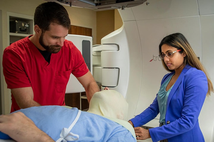 Radiation Oncology residents work with a patient at Mayo Clinic in Jacksonville, Florida.