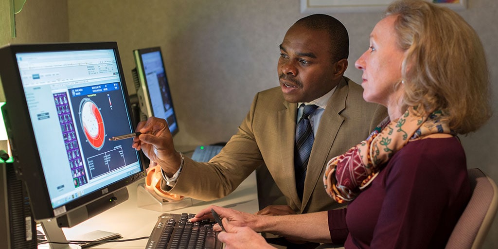 Mayo Clinic cardiology trainee reviewing imaging scan results with faculty member