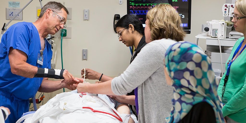  Surgical critical care staff work on a patient