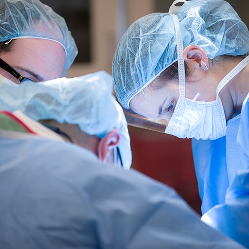 Surgical critical care doctors performing surgery