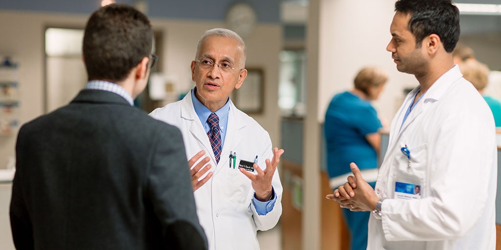 Transplant hepatologist Patrick S. Kamath, M.D., reviewing a teaching point with fellows