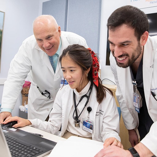Medical student works with a faculty member and another student on a computer at Mayo Clinic Alix School of Medicine.