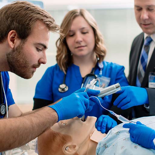 Trainees performing a procedure in the Simulation Center