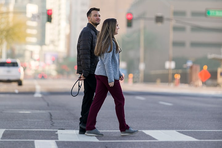 Medical students walk in city street during the day for street medicine selective