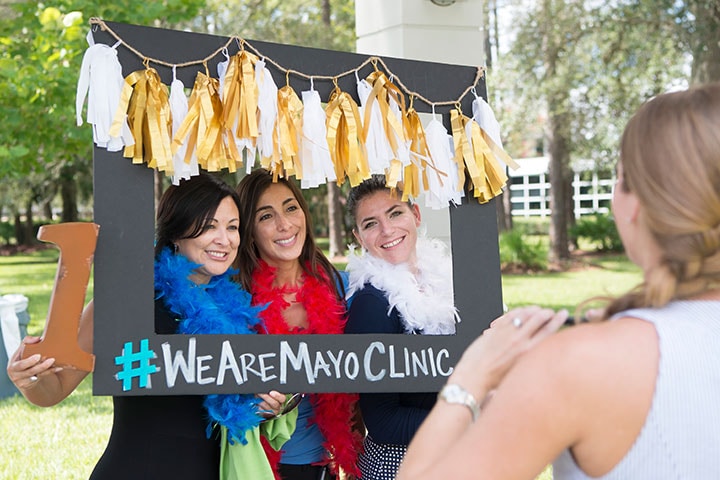Mayo Clinic staff with #WeAreMayoClinic sign