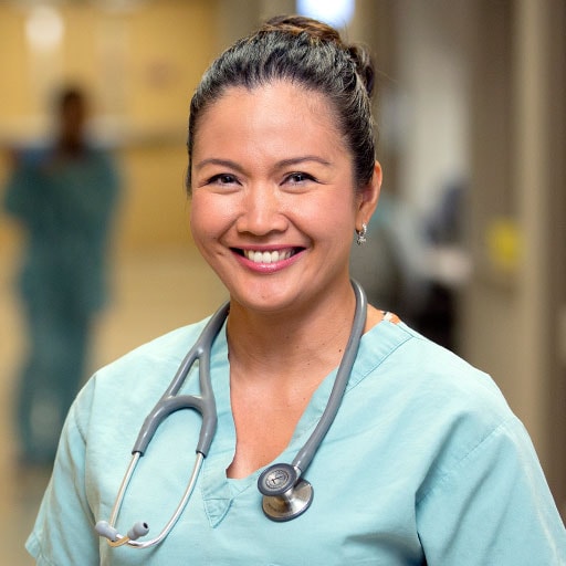 Mayo Clinic nurse smiling in a hospital hallway
