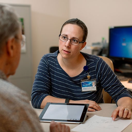 Mayo Clinic medical speech language pathologist listening to a patient