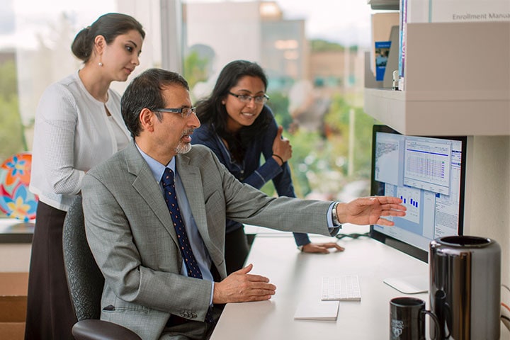 Mayo Clinic faculty member reviewing test results with two trainees