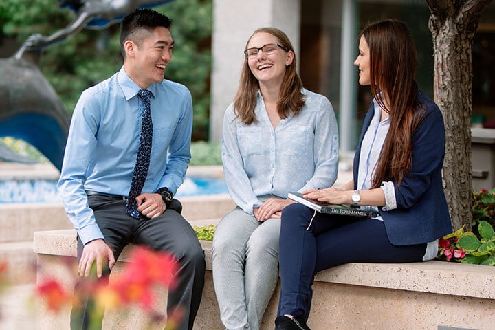 Mayo Clinic students talking in Rochester campus plaza